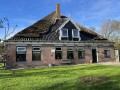 Foto van Gangbaar melkgeitenbedrijf met stolpboerderij